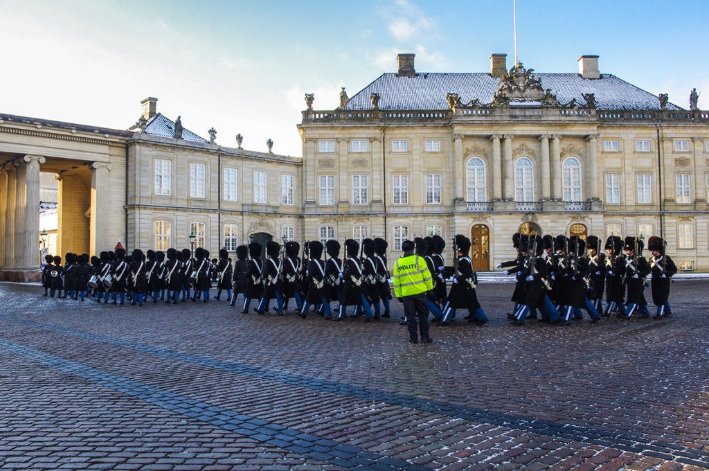 Watch the changing of the guard at Amalienborg Palace in Copenhagen.